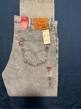 Levi's 511 Slim Men's Jeans in Light Blue Acid Wash. The waist 38 and length 30